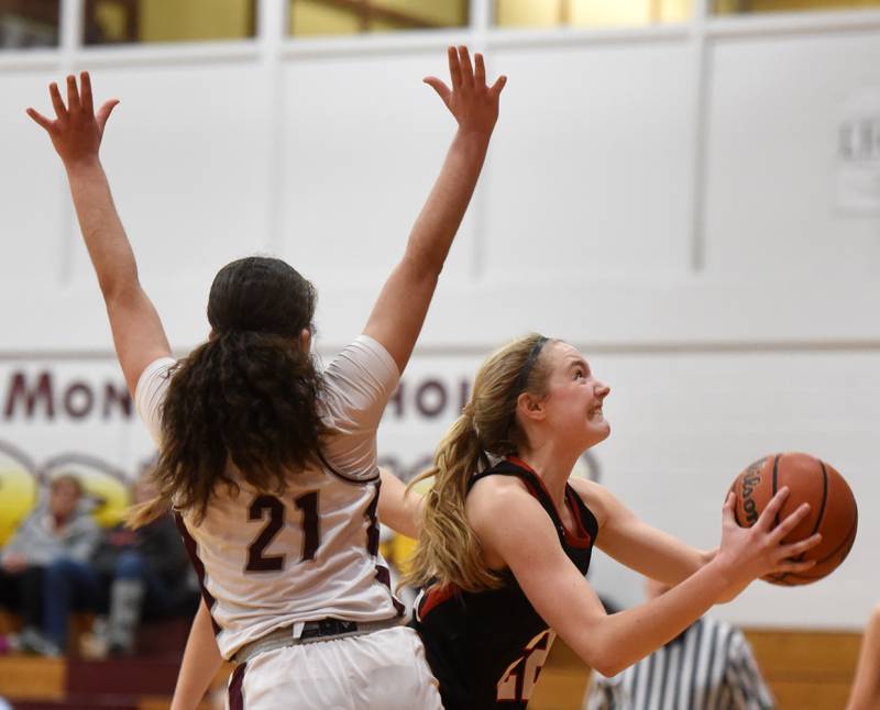 Benet Academy’s Bridget Rifenburg, right, goes to the basket against Montini’s Alyssa Epps during the semifinal of the Montini girls basketball Tournament Thursday December 28, 2023 in Lombard.