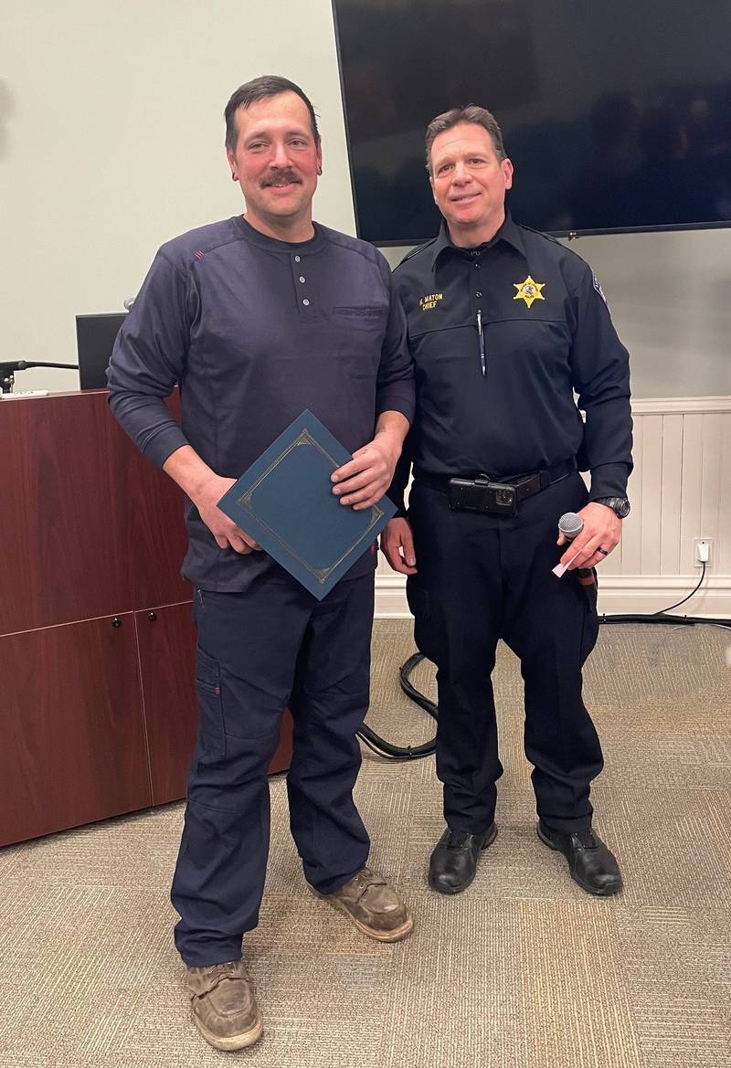CITGO Lemont Refinery employee Jared Reed is recognized by the Village of Lemont Police Chief Marc Maton on Feb. 26.