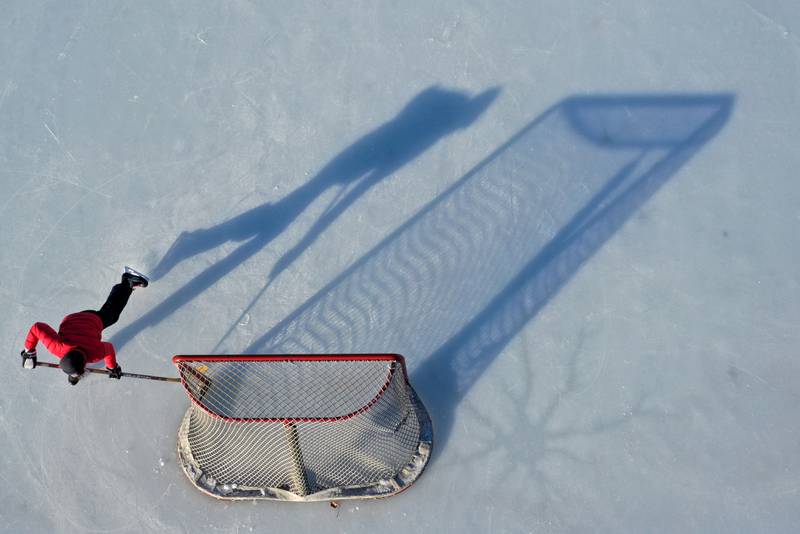 Henry Burr 11, of Spring Valley plays hockey at the ice rink in Washington Park on Wednesday, Feb. 1, 2023 in Peru.