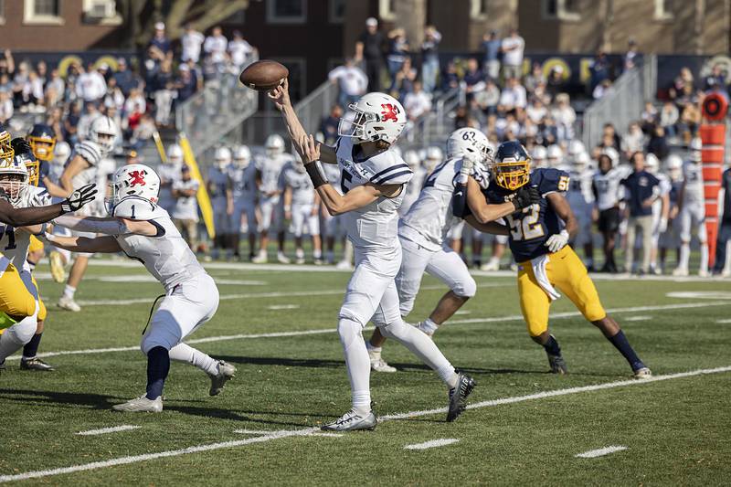 St. Viator’s Cooper Kmet fires a pass down field against Sterling their first round playoff game Saturday, Oct. 29, 2022.