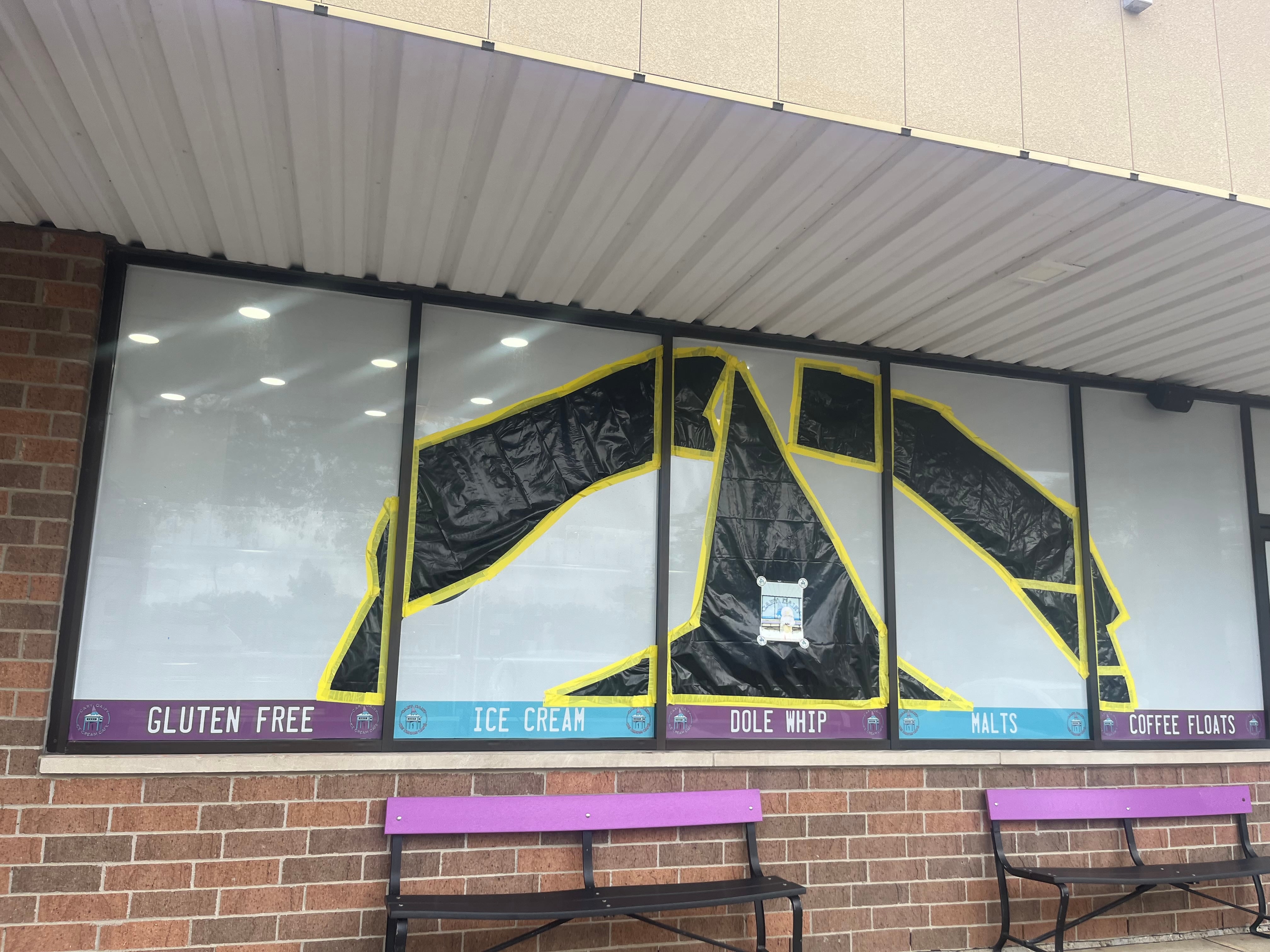 The Cary Dairy window sign is now covered, which owner Randy Scott says is in compliance.