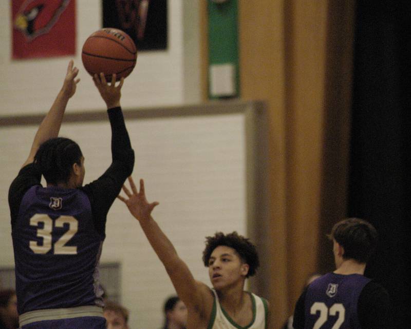 Dixon's Darius Harrington shoots over Rock Falls' Devin Tanton-DeJesus during their game Tuesday, Feb. 6, 2024, at Rock Falls High School.