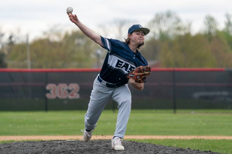 Oswego East's Bode Bregar (18) delivers a pitch against Yorkville during a 2023 baseball game at Yorkville High School.
