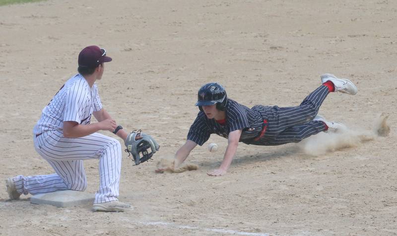 Hall's Hunter Edgcomb slides safely into third base as the throw comes in late to Chillicothe's CK Witte during the Class 2A Regional game on Saturday, May 18, 2024 at Kirby Park in Spring Valley.