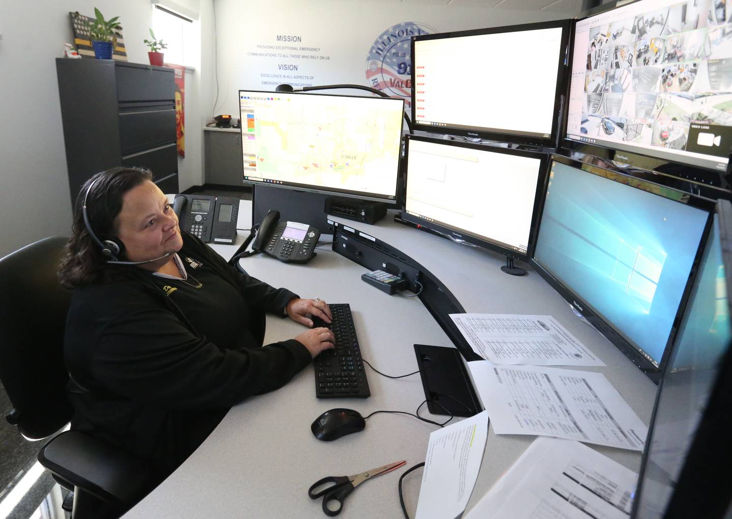 Julie Dean, a dispatcher for the Illinois Valley Regional Dispatch, works at her desk on Monday, April 15, 2024, in Peru. Dean is a highly-regarded veteran in the dispatch field.