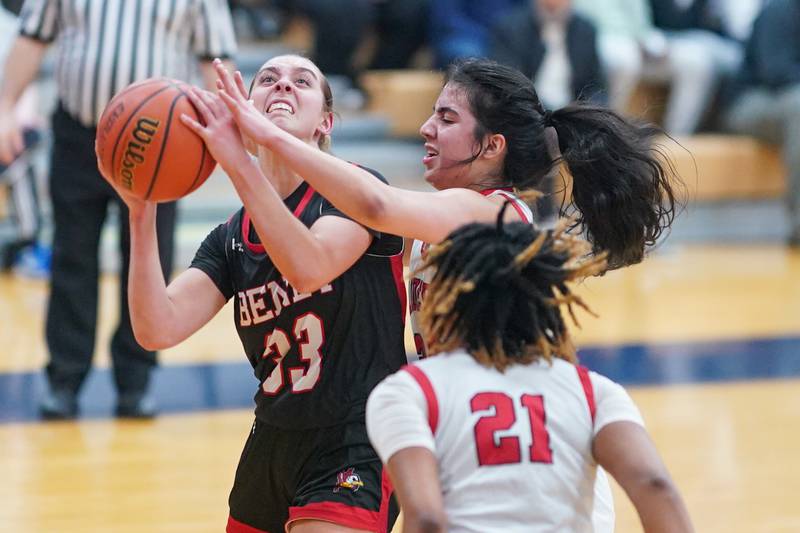 Benet’s Magdalena Sularski (33) shoots the ball in the post against Bolingbrook's Yahaira Bueno (24) during a Oswego semifinal sectional 4A basketball game at Oswego High School on Tuesday, Feb 20, 2024.