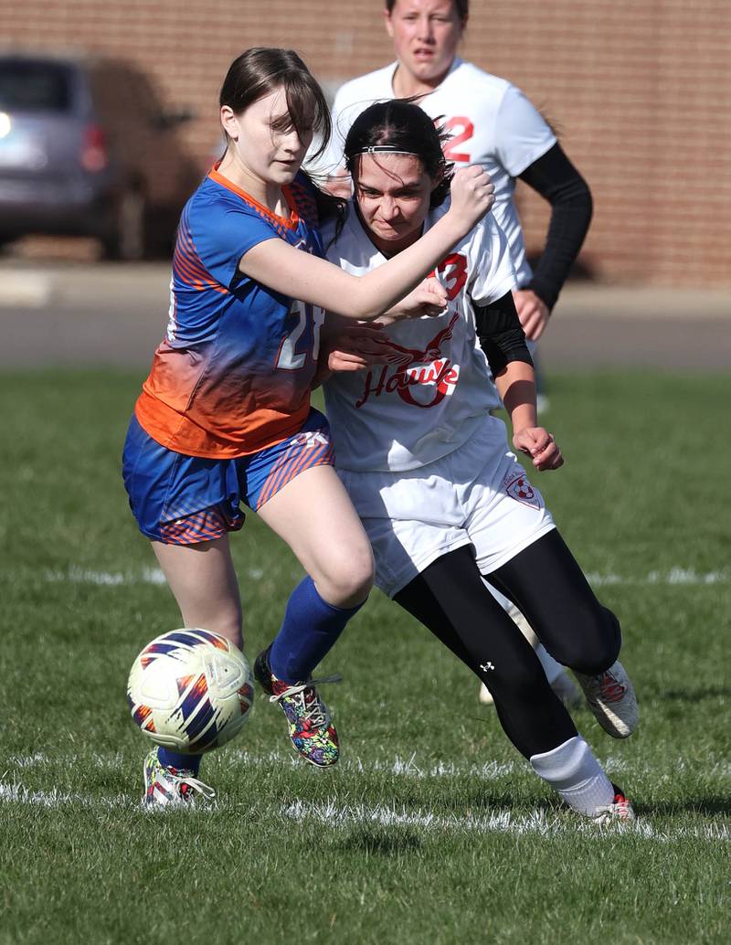 Genoa-Kingston's Ellianen West (left) and Oregon's Sarah Eckardt collide at the ball during their game Friday, April 5, 2024, at Genoa-Kingston High School.