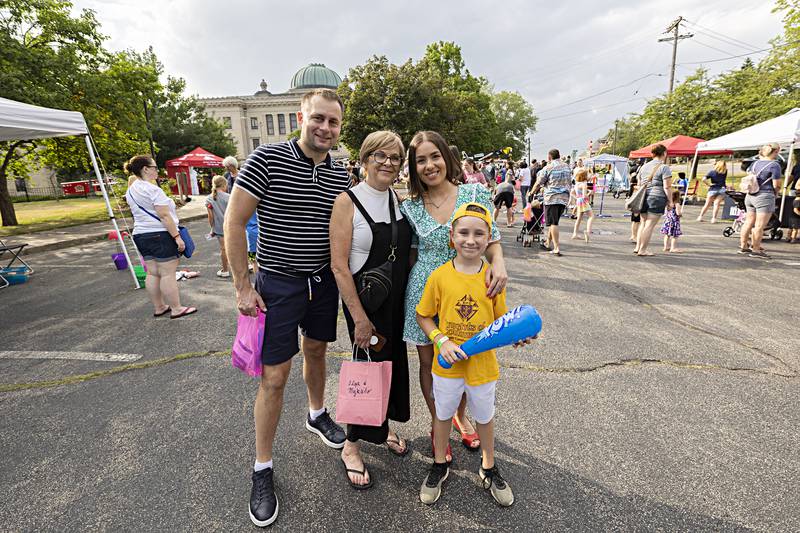 Dawn Summers (middle) helped bring in Ukrainian refugees Vlad Vitomskov, Olesia Avramenko and her son Vova, 8, into the states. The group was spending the day at Petunia Fest’s Family Fun night Friday, June 30, 2023.