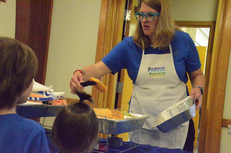 Rev. Tammy Scott, pastor at Wesley United Methodist Church in Aurora, dishes pancakes at an interfaith Pride Cakes breakfast Sunday, June 9, at Aurora's New England Congregational Church, 406 W. Galena Blvd., Aurora.