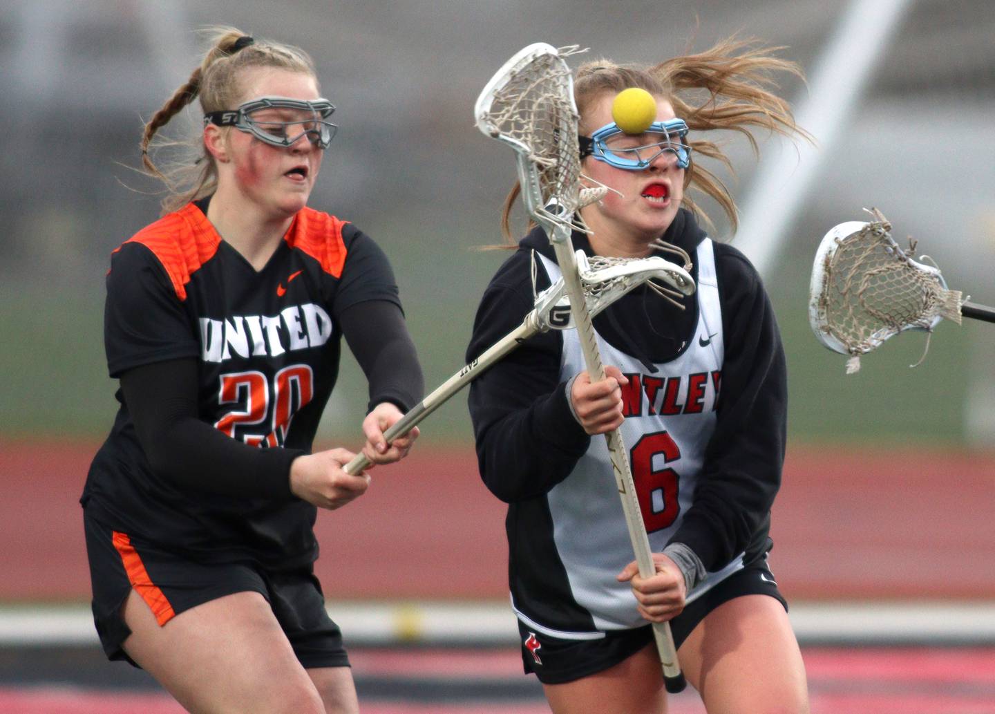 Huntley’s Leah Holmberg, right, battles Crystal Lake Central’s Maddi Lieflander in varsity lacrosse at Huntley Wednesday.