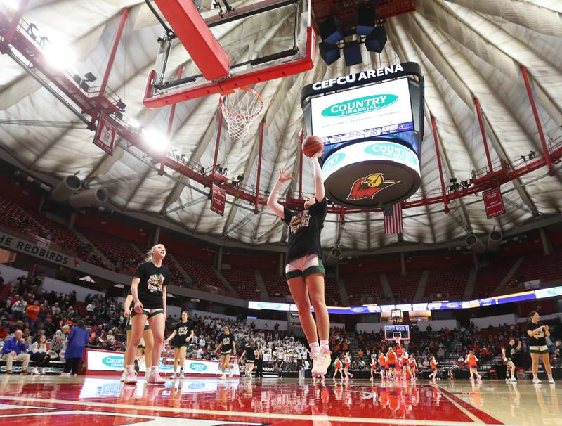 St. Bede's Ali Bosnich runs in for a layup during warm-up's before the Class 1A State semifinal game on Thursday, Feb. 29, 2024 at CEFCU Arena in Normal.