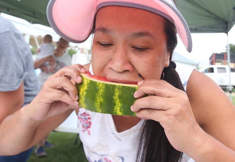 Nora Schroeber of Canopolies N.C. munches on watermelon during the La Salle County 4-H Fair on Thursday, July 11, 2024 in Ottawa. Schroeber won the adult contest.