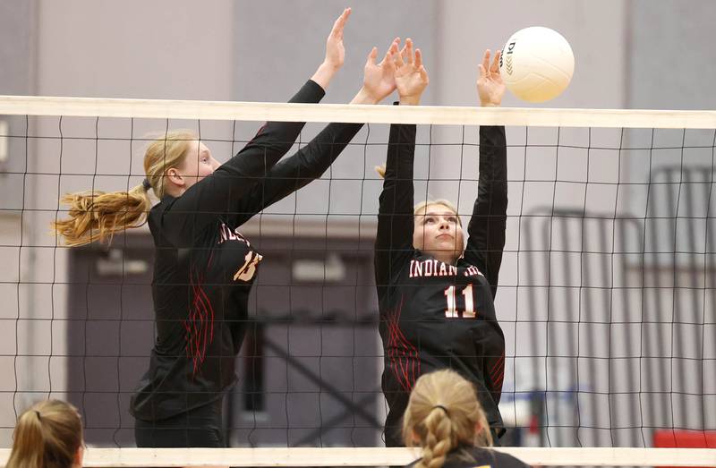 Indian Creek's Allie Peterson (left) and Madison Bogle try to block during their regional first round match against Somonauk Tuesday, Oct. 25, 2022, at Aurora Christian High School in Aurora.