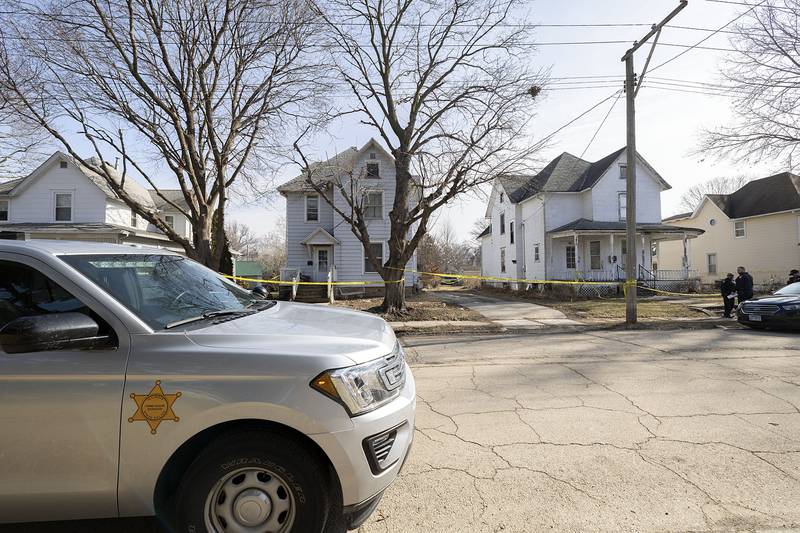 Investigators work at the scene Monday, Feb. 20, 2023 of a Sunday night shooting in the 1100 block of 4th Ave. in Sterling. One victim was pronounced dead with four taken into custody.