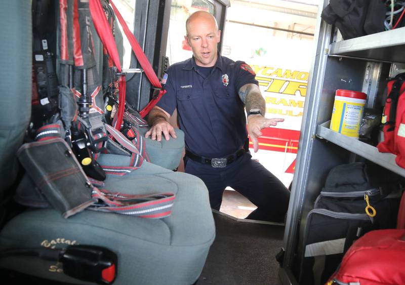 Ian Wheeler, a Sycamore firefighter/paramedic, talks Tuesday, June 11, 2024, at Sycamore Fire Station 1, about the items carried aboard one of the engines.The department recently released their annual report and one of the items highlighted was the departments need for a ladder truck.