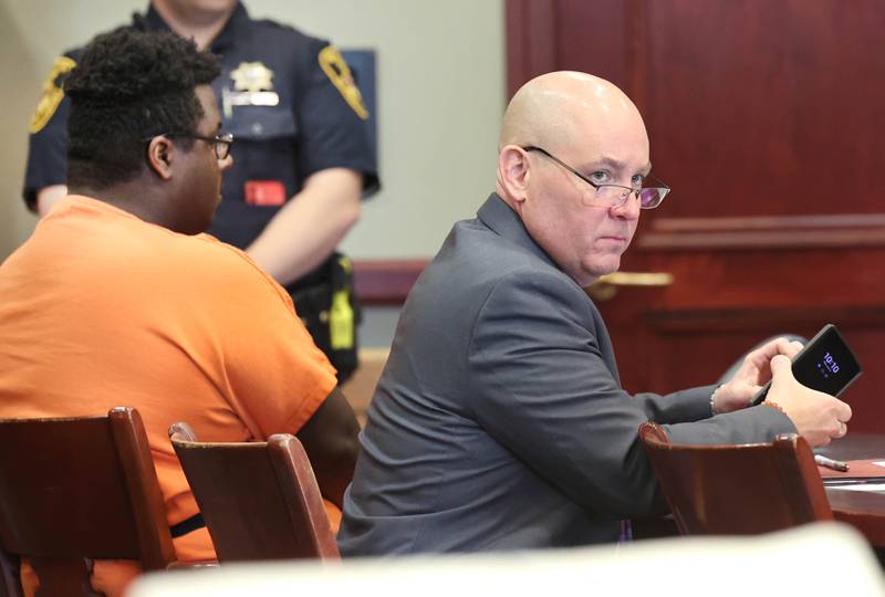 Timothy M. Doll, 29, of DeKalb, (left) and his attorney Andrew Nickel listen Wednesday, June 14, 2023, at the DeKalb County Courthouse, as Circuit Court Judge Philip Montgomery and prosecuting attorney Scott Schwertley choose a date for the next proceedings. Doll was being arraigned on several charges including two counts of first-degree murder in the death of 15-year-old Gracie Sasso-Cleveland of DeKalb.