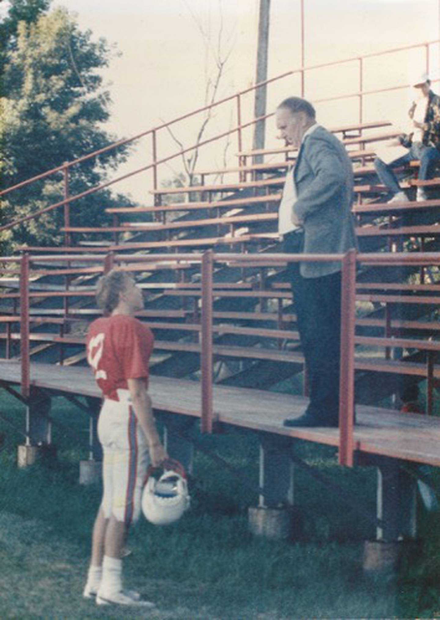 Former Marian Central receiver and quarterback Greg Penza talks to his father Don during the 1988 season.