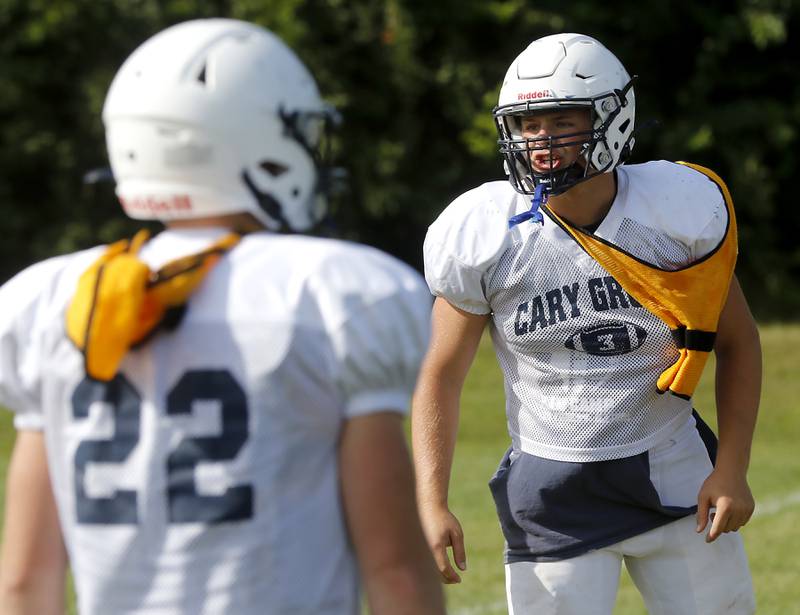 Linebacker Charlie Ciske calls out the defensive play during football practice Tuesday, Aug. 20, 2024, at Cary-Grove High School, as the 2023 IHSA Class 6A champions look to defend their title.