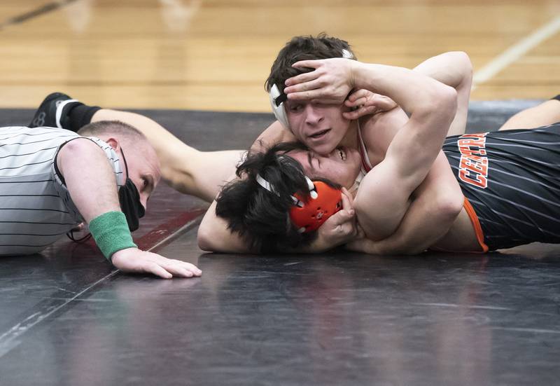 Huntley's Aiden Lira pins Crystal Lake Central's Hayden Frankowski during the 113 pound match on Thursday, January 27, 2022 at Huntley High School.