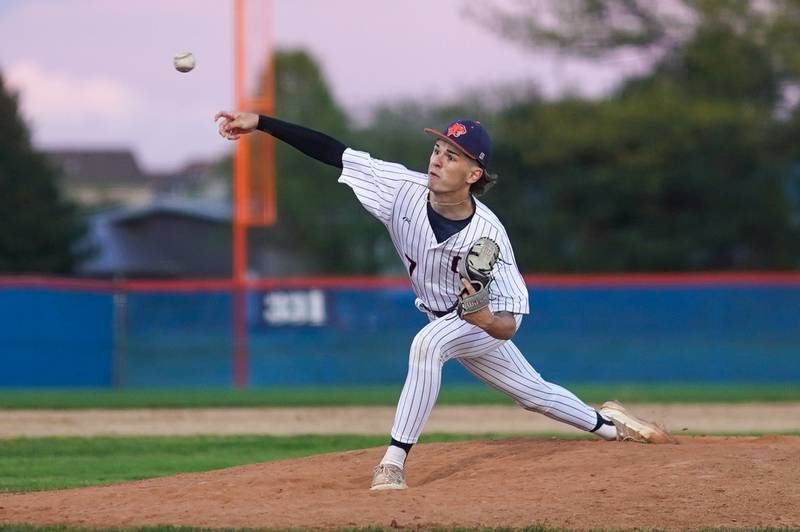 Oswego’s Dominic Stringham (7) delivers a pitch against Yorkville during a baseball game at Oswego High School on Monday, April 29, 2024.