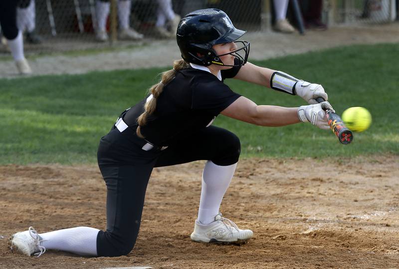 Prairie Ridge’s Emma Dallas tries to bunt the ball in a Fox Valley Conference softball game against Huntley on Monday, April 29, 2024, at Prairie Ridge High School.