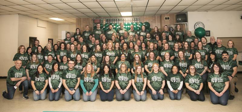 Sauk Valley Bank staff members take a group photo to celebrate the bank's 25th anniversary.