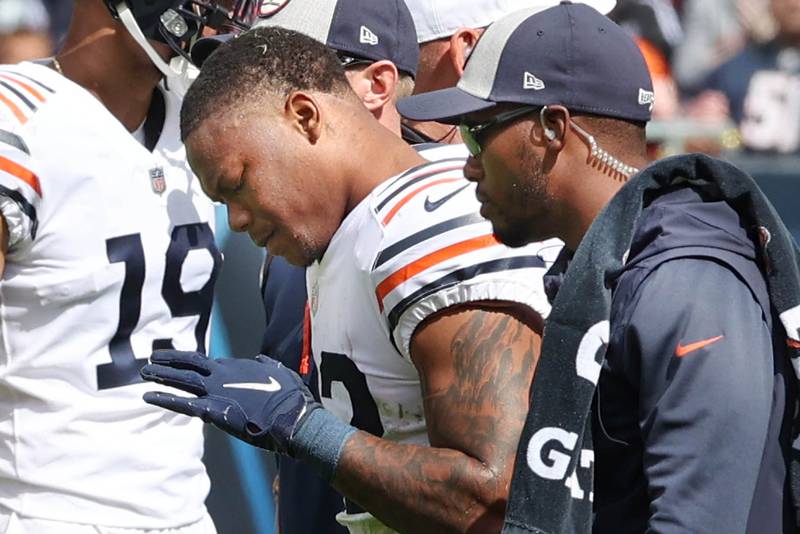 Chicago Bears running back David Montgomery is helped off the field after being injured during their game against the Texans Sunday, Sept. 25, 2022, at Soldier Field in Chicago.