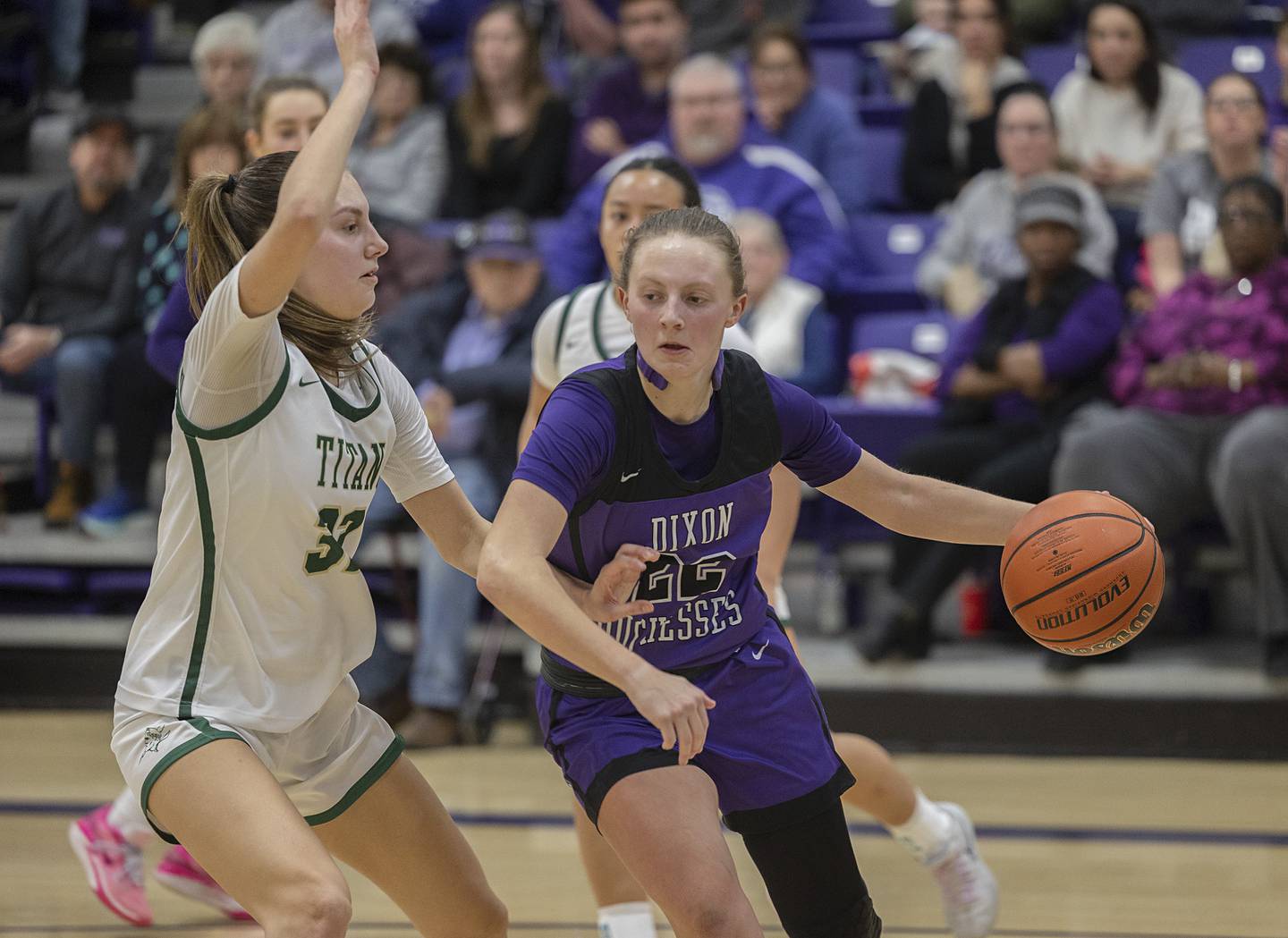 Dixon’s Katie Drew handles the ball against Boylan’s Lily Esparza Friday, Feb. 16, 2024 at the class 3A Rochelle girls basketball regional.