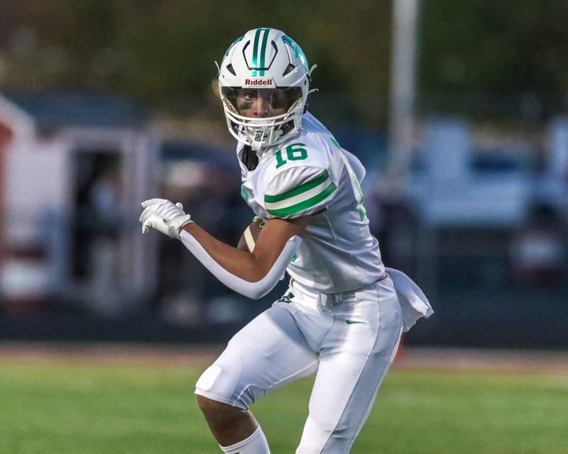 York's Simon Kodosky (16) looks for running room after coming down with a short catch during a football game between York at Plainfield North on Friday, Sept 6th, 2024 in Plainfield. Gary E Duncan Sr for Shaw Local News Network.