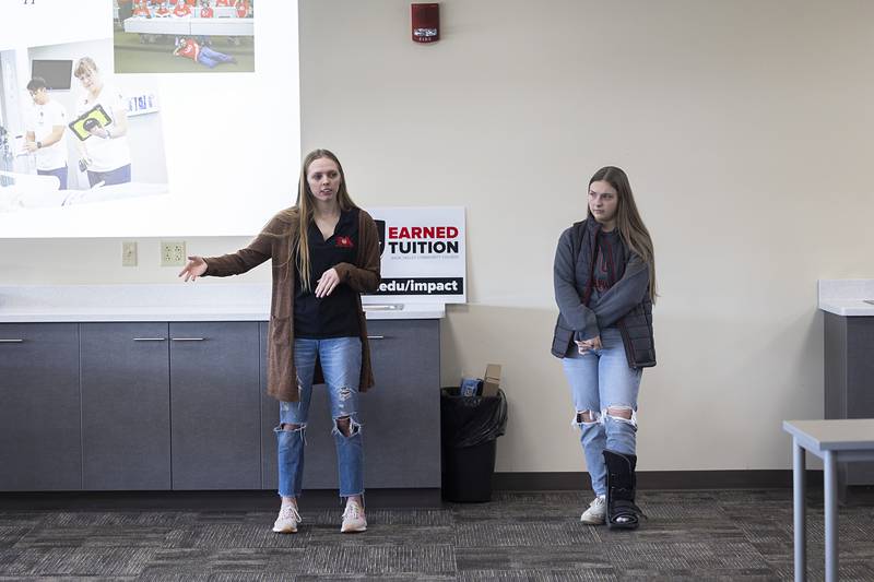 SVCC student ambassadors Morgan Leslie (left) and Holli Miller of Dixon speak to high school students and their parents Monday, Feb. 19, 2024, about why they chose to attend the school. The two cited cost savings, location, easily transferable credits and adaptable schedules as benefits at the school. Both will be going on to four-year universities after graduation.