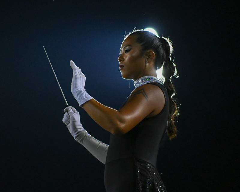 The drum major for the Phantom Regiment out of Rockford, Illinois, conducts during the group's performance at the Drum Corps International Midwest Classic on Saturday, July 13, 2024, at Northern Illinois University Huskie Stadium in DeKalb.