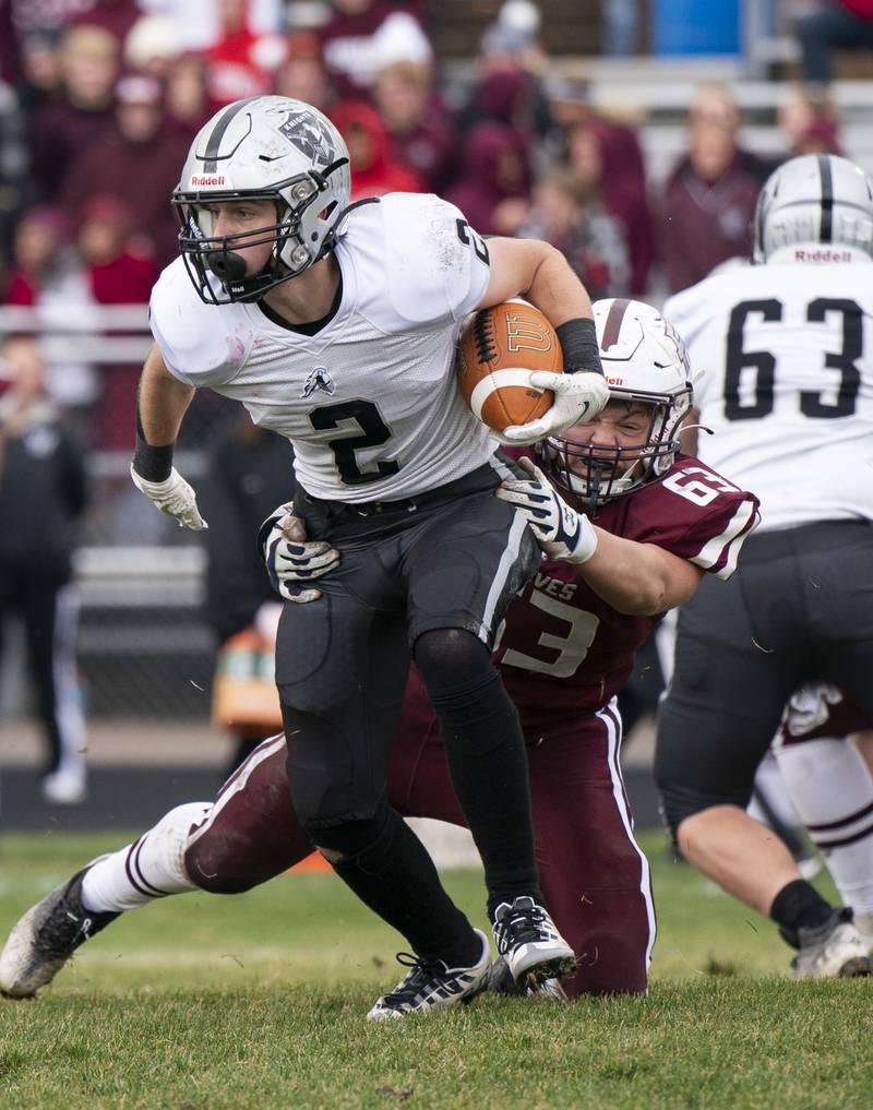 Kaneland's Johnny Spallasso is brought down by Prairie Ridge's Walter Pollack during the 6A second-round football playoff game on Saturday, November 5, 2022 at Prairie Ridge High School in Crystal Lake. Prairie Ridge won 57-22.