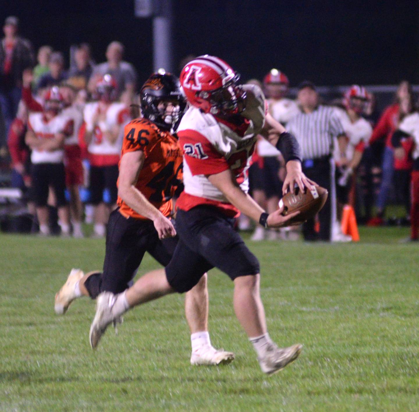 Amboy's Quinn Leffelman (21) catches a pass as Milledgeville's Spencer Nye (46) chases him during Friday, Sept. 29, 2023 action at Milledgeville High School.