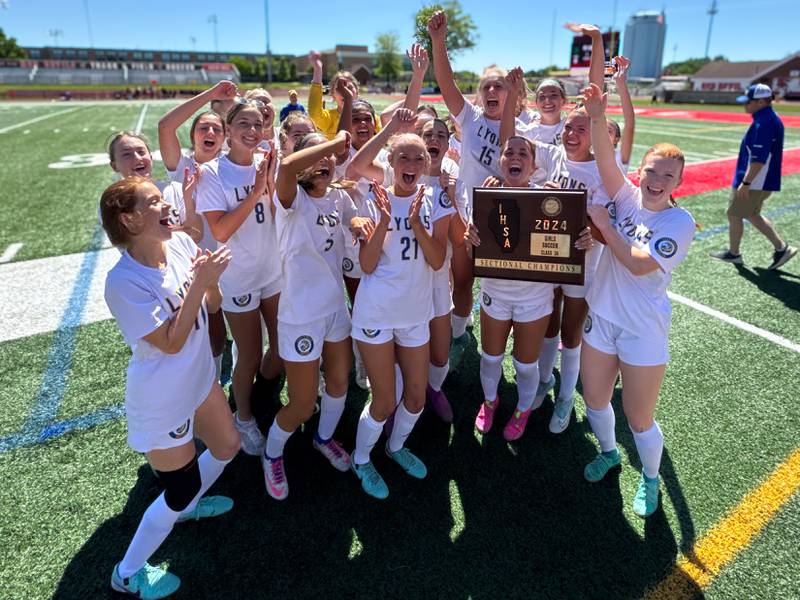 Lyons players celebrate their victory over York to win the  Class 3A Hinsdale Central Sectional girls soccer championship at Hinsdale Central High School on Saturday, May 25, 2024.