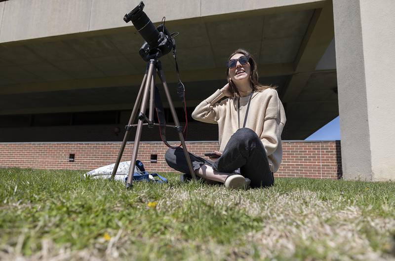 SVCC Biology professor Lauren Orton set up her camera to take a few shots of the eclipse Monday, April 8, 2024 on the east lawn of the school. Orton warned her students that they may see her “nerding out” over the eclipse.