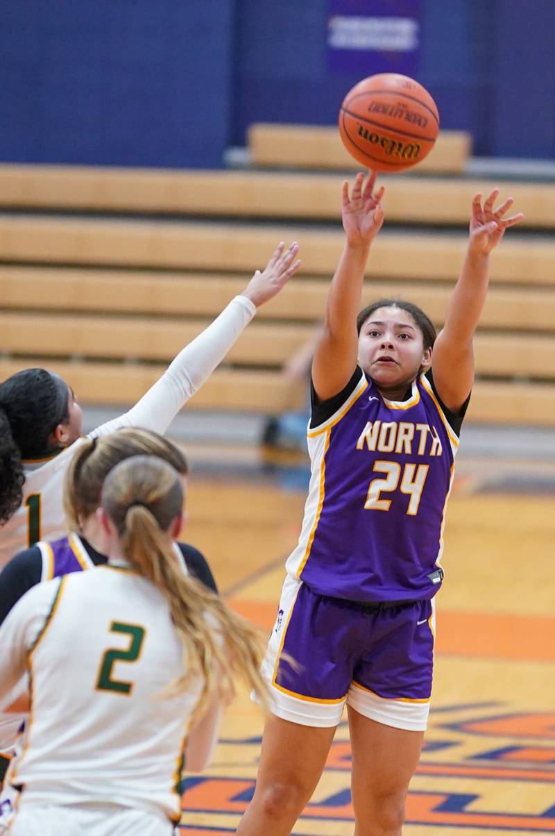 Downers Grove North's Hope Sebek (10) shoots a three pointer over Waubonsie Valley's Arianna Garcia (1) during a Oswego semifinal sectional 4A basketball game at Oswego High School on Tuesday, Feb 20, 2024.