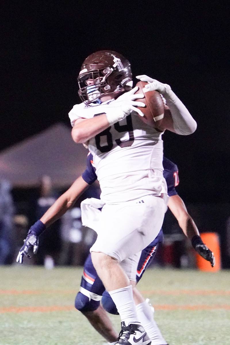 Joliet Catholic's Ryan Yurisich (89) catches a pass against Oswego during a football game at Oswego High School on Friday, Sep 6, 2024.