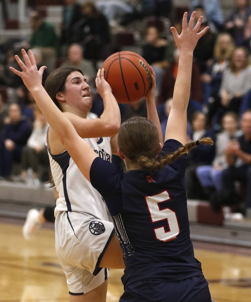 Cary-Grove's Kennedy Manning drives to tbe basket against St. Viator's Kyli Ziebka during an IHSA Class 3A Antioch Sectional semifinal girls basketball game on Tuesday, Feb. 20, 2024, at Antioch High School.