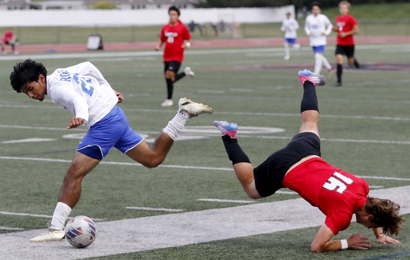 Huntley's Tylar Caddick flies to the ground after being fouled by Larkin's Juan Lopez during a nonconference soccer match on Thursday, Sept. 5, 2024, at Huntley High School.