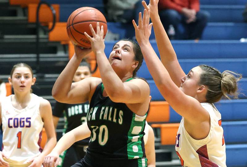 Rock Falls' Taylor Reyna gets a shot in front of Genoa-Kingston's Regan Creadon during their game Friday, Feb. 2, 2024, at Genoa-Kingston High School.