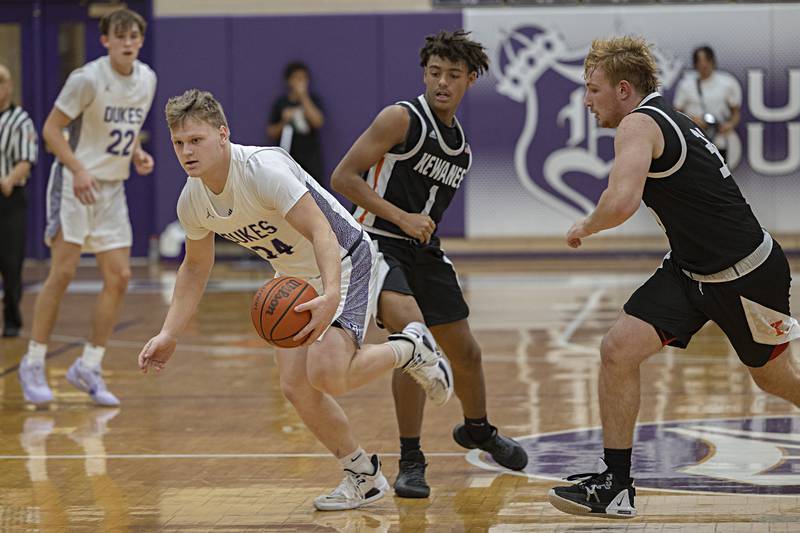 Dixon’s Eli Davidson handles the ball against Kewanee Tuesday, Nov. 28, 2023 in Dixon.