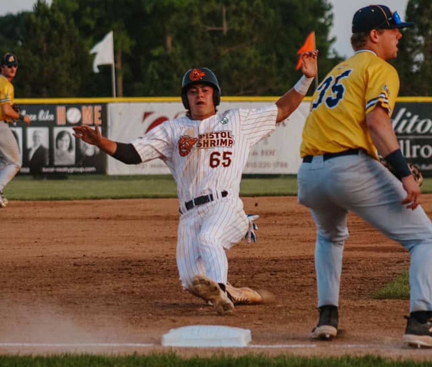 Kyle Gibson slides into third base during the Illinois Valley Pistol Shrimp's 14-1 win over the Lafayette Aviators on Wednesday, June 12, 2024 at Schweickert Stadium in Peru.