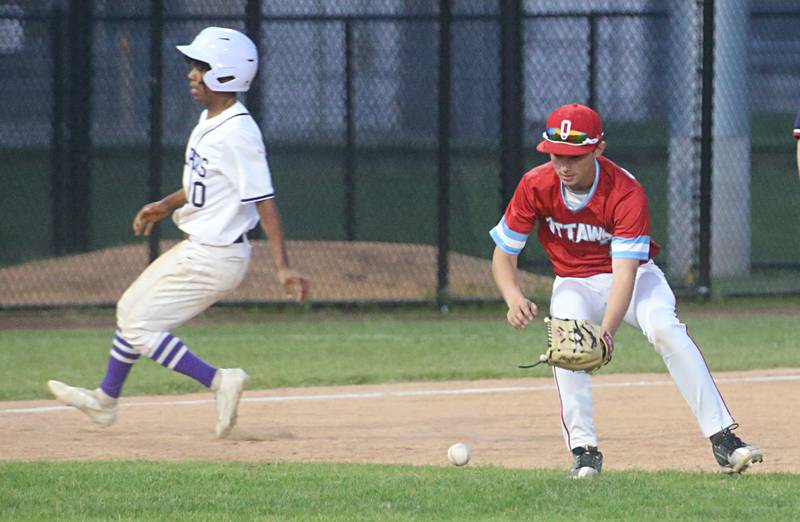 Ottawa's Lucas Farabaugh fields a ground ball as Plano's Amari Bryant advances to third during the Class 3A Regional semifinal game on Wednesday, May 22, 2024 at Huby Sarver Field in La Salle.