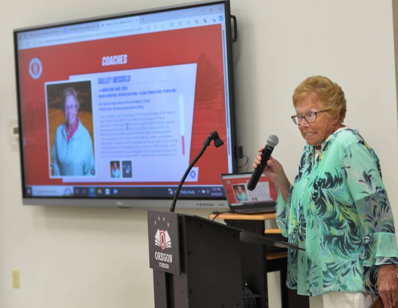 Salley Wessels makes a joke about speaking too long as she is inducted into the OCUSD Hall of Fame during a ceremony on Saturday, Sept. 14, 2024 at the Rock River Center in Oregon.