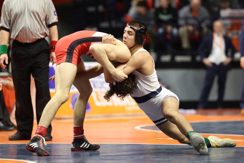 IC Catholic’s Deven Casey pulls down Glenwood’s Drew Davis in the 120-pound Class 2A state championship match on Saturday, Feb. 17th, 2024 in Champaign.