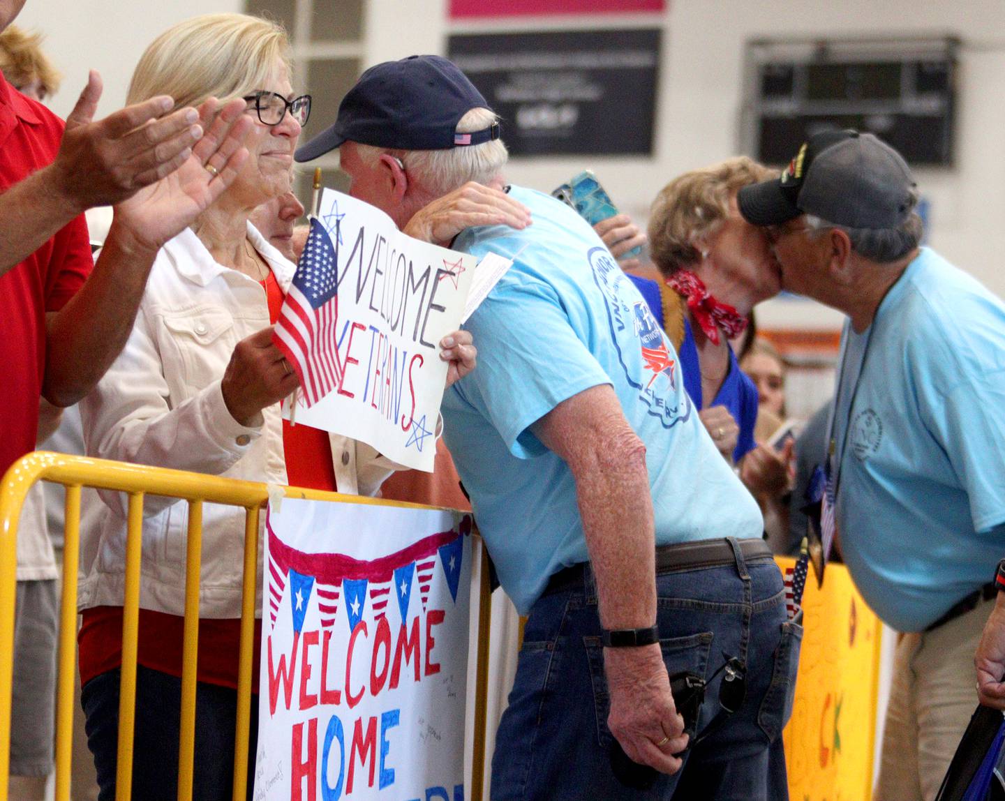 People offer a warm welcome as McHenry Community High School hosted a celebration Sunday for veterans returning from an Honor Flight trip to Washington D.C. The Honor Flight trip was coordinated by the Veterans Network Committee of Northern Illinois.