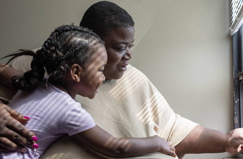 Kaneesha Mallory, 34, looks out the window of her apartment with her 4-year-old daughter Bre’Chelle on April 19, 2024, at the Loarn L. Shuemaker Jr. Building in Cairo. Mallory has lived in Cairo nearly her entire life and returned in 2002 after moving away with her family in 1998.