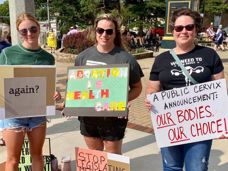 (From left) Hannah Walker, 16, of Kingston, Michelle Walker, 42, of Kingston and Jen Barton, 45, of Genoa, protest the overturning of Roe v. Wade during a Rally for Reproductive Rights in downtown DeKalb on Saturday, June 22, 2024. Organizers said the event was held to mark two years since the U.S. Supreme Court overturned federal protections for abortion access, and to help mobilize voters to support pro-abortion candidates ahead of the November election.