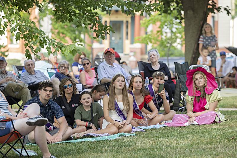 The Petunia royalty listens as Tom Wadsworth channels Thomas Jefferson and reads aloud the Declaration of Independence Friday, June 30, 2023 on the lawn of the old Lee County Courthouse.