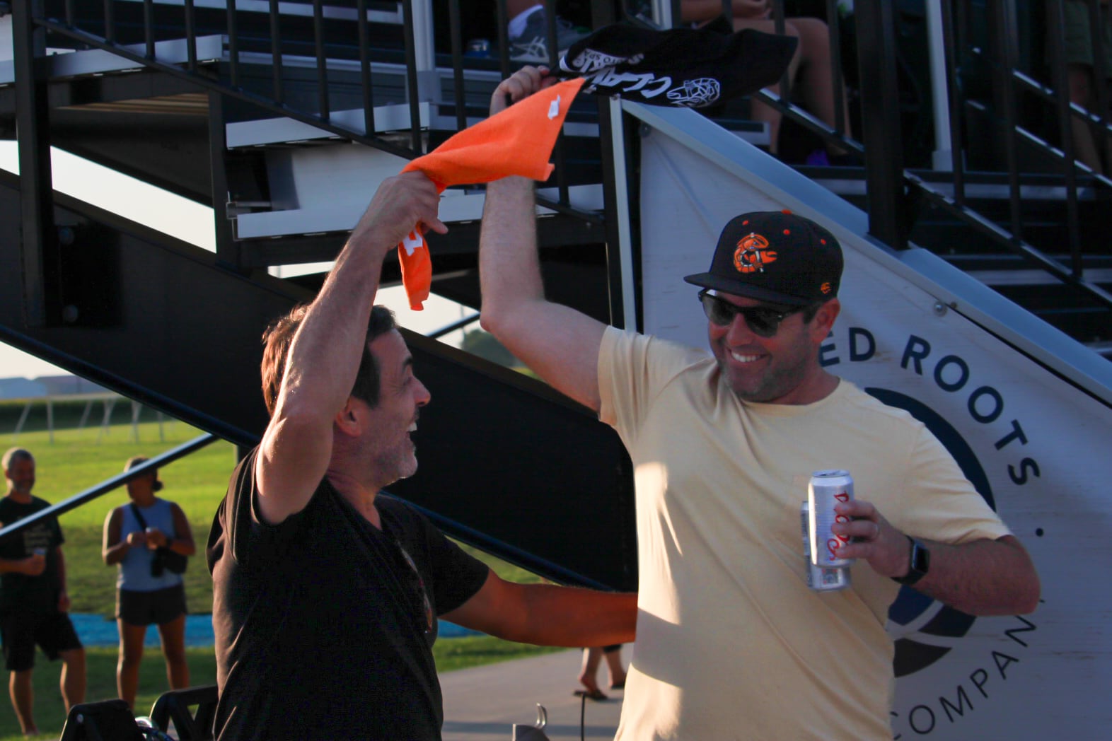 Illinois Valley Pistol Shrimp fans wave rally flags during the team's first playoff game on Thursday, Aug. 1, 2024, at Schweickert Stadium at Veterans Park in Peru.